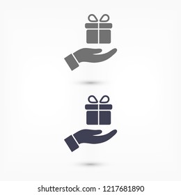 a gift in the hand icon