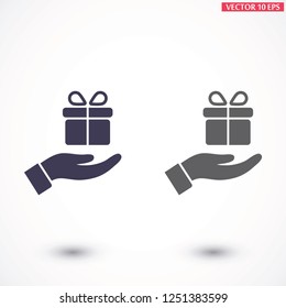 a gift in the hand icon