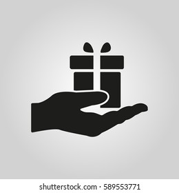 Gift in hand icon. Birthday, present, surprise symbol. Flat design. Stock - Vector illustration