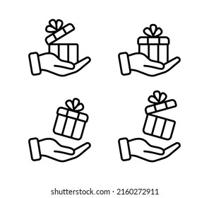 Juego de iconos de regalo en la mano. Caja de regalo en mano. Símbolos sorprendentes. Trazo editable. Ilustración del vector