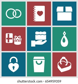 Gift icons set. set of 9 gift filled icons such as earring, notebook with heart, heart lock, rings, ring in box, box, shopping bag