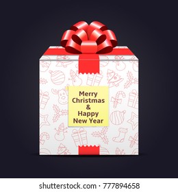 A gift with the inscription of a Merry Christmas and Happy New Year on a sticky note