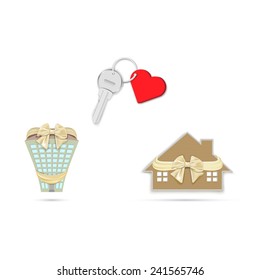 Gift key with heart on a chain and a house with a bow isolated on a white background