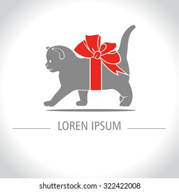 Gift kitten. Kitten with red bow at the neck.