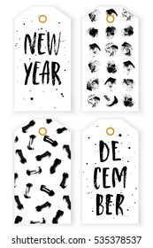 Gift labels with lettering "New Year", "December" and black abstract  brush strokes