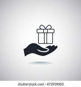 Gift on the hand icon Vector.
