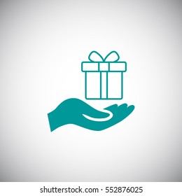 Gift on the hand icon Vector.