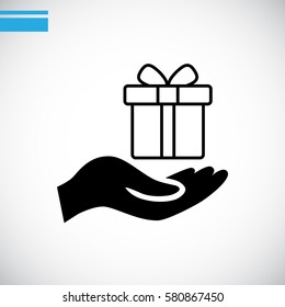 Gift on the hand icon Vector.
