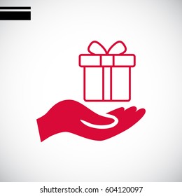Gift on the hand icon Vector.