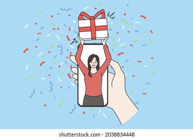Gift order and delivery online concept. Human hand holding smartphone with smiling happy female with gift box in hands on screen, delivery or loyalty program vector illustration
