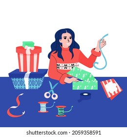 Gift packaging. Woman is packing gifts for Christmas
