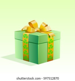 Gift packed in a box and tied with a ribbon. Clover, shamrock.