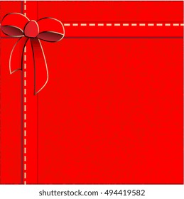 Gift with red textured wrapping paper, silk ribbon and bow - background
