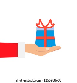 Gift from Santa Claus. Santa Claus holding white gift box in hand. Vector illustration flat design. Merry Christmas and Happy New Year n
