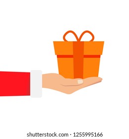 Gift from Santa Claus. Santa Claus holding white gift box in hand. Vector illustration flat design. Merry Christmas and Happy New Year x
