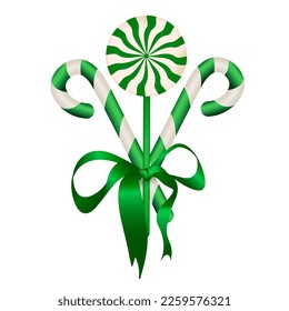 Gift set of candy canes and green candy decorated with green silk ribbon, for the holidays of christmas, new year, st. patrick's day, birthday