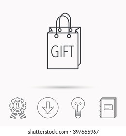 Gift shopping bag icon. Present handbag sign. Download arrow, lamp, learn book and award medal icons.