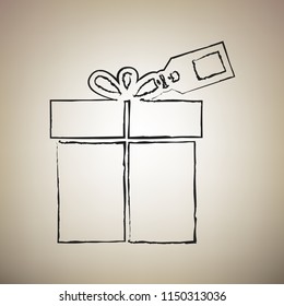 Gift sign with tag. Vector. Brush drawed black icon at light brown background.