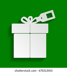 Gift sign with tag. Vector. Paper whitish icon with soft shadow on green background.