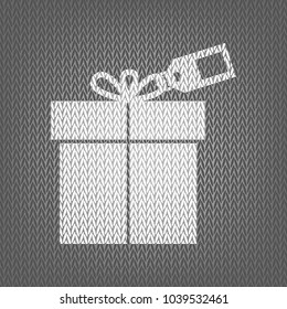 Gift sign with tag. Vector. White knitted icon on gray knitted background. Isolated.