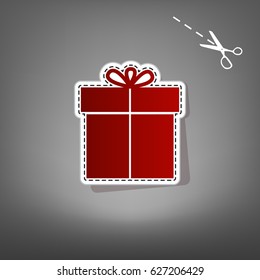 Gift sign. Vector. Red icon with for applique from paper with shadow on gray background with scissors.