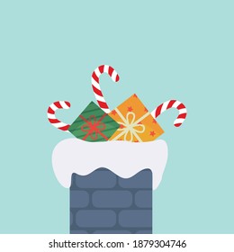 Gift stuck in chimney winter snowy landscape. Merry Christmas postcard