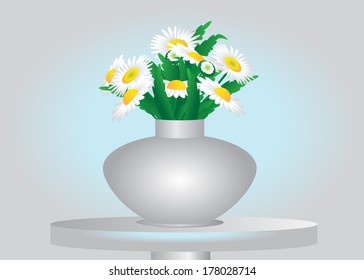 Gift. Summer bouquet with flowers in a vase on a table.