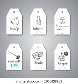 Gift tags with Make up hand drawn design. Labels for beauty items. Collection of brushes, nail polishes, lipsticks hanging for promo.