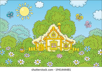 Gift wicker basket of traditionally colored eggs near a small thatched hut among colorful flowers and merry flittering butterflies on a pretty green glade under a branchy tree on a sunny Easter day
