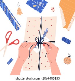 Gift wrapping process with box, scissors and thread from above, flat vector illustration isolated on white background.