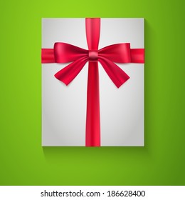 Gift wrapping with red bow and ribbon, top view