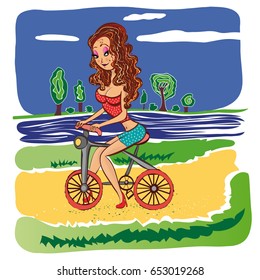 Ginger girl on bicycle in park at summer