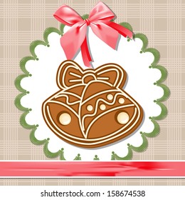 Gingerbread bell on a white napkin.
