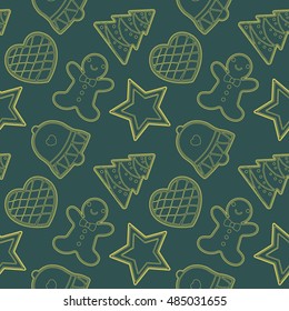 Gingerbread cookies seamless pattern. Christmas cookies on green background.Bell,star,man,heart,tree.