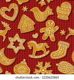 Las galletas de pan de jengibre son un patrón impecable sobre fondo de tejido rojo. Galletas dulces y festivas en forma de hombre, copo de nieve y pájaro, migaja y casa, caballo balancín y reno. Diseño de pastelería horneada