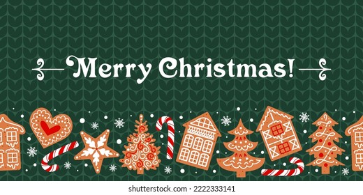 Gingerbread, decorated with icing, lie on a green knitted sweater. Christmas seamless border. traditional cookies. Houses, candy cane, snowflakes and hearts. For wallpaper, banners, fabric, wrapping