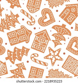 Gingerbread decorated with icing. On a white background. Christmas seamless pattern. traditional cookies. Houses, candy cane, snowflakes and hearts. For wallpaper, fabric, wrapping.