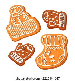 gingerbread in the form of winter clothes with white icing. Cookies in the shape of a hat, mittens, sock