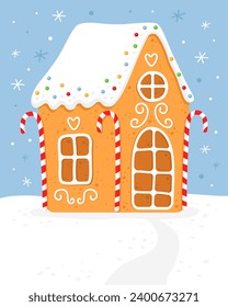 Gingerbread house with red white striped christmas candies. Cute house with white roof,  and white sugar glaze.  Blue background. Christmas card.  