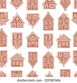 Gingerbread houses. Seamless pattern with gingerbread house. Cute Christmas background. Brown colors.