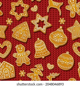 Gingerbread seamless pattern on red knitting background. Festive cookies in shape of men, snowflakes and trees, stars and houses, snowflakes and reindeers. Vector baked biscuits design