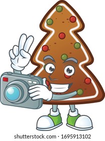 Gingerbread tree photographer mascot design concept using an expensive camera