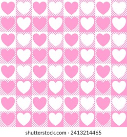 Gingham patterns with hearts in pink and white. Seamless Scottish tartan vichy textured check plaid for dress, shirt, tablecloth, gift wrapping, or other modern Valentines Day holiday print.