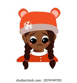 Girl of African American or Latin nationality with sad emotions, depressed face, down eyes in bear hat with snowflake. Cute baby melancholy expression in winter headdress. Head of adorable child