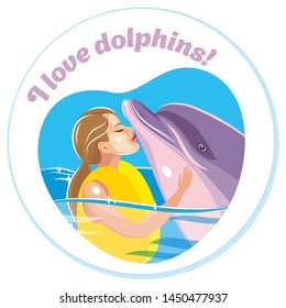 A girl ambrasing and kissing a dolphin