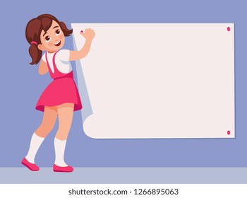 girl attaches a sheet of paper to the wall