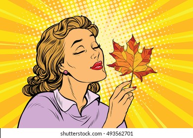 Girl and autumn, a woman with red maple leaf. pop art retro vector illustration. The seasons of nature