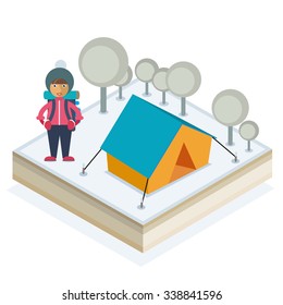 A girl with a backpack and a tent in a winter forest