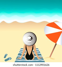 A girl in a bathing suit sunbathing on the beach.Girl on the beach. Summer is a rest time. 