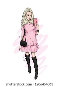 A girl in a beautiful dress makes selfie with a smartphone. Fashion, style, clothing and accessories. Vector illustration. Stylish girl. Beautiful dress, boots and bag.